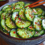 Refreshing sesame ginger cucumber salad served in a rustic bowl
